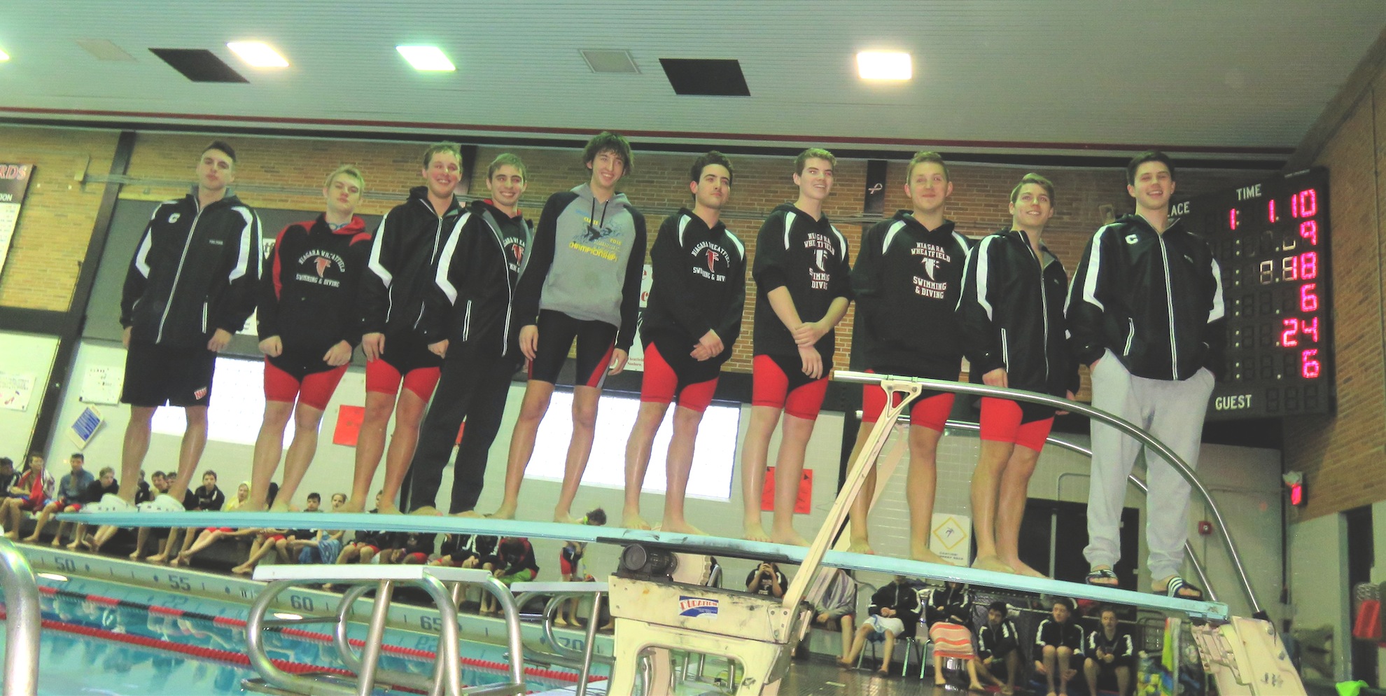 The 10 seniors from the Niagara-Wheatfield boys swimming and diving team stand atop the diving board. 